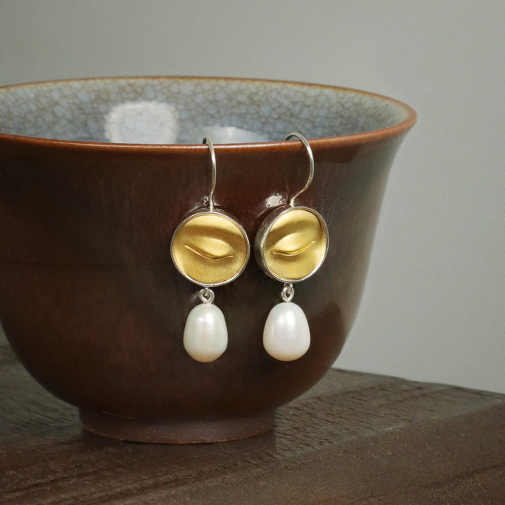 
                  
                    Earrings-With-Buddha-Eyes-And-Freshwater-Pearl-By-Yonandole_3
                  
                