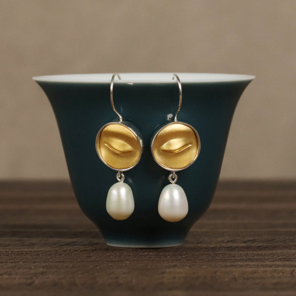 
                  
                    Earrings-With-Buddha-Eyes-And-Freshwater-Pearl-By-Yonandole_8
                  
                