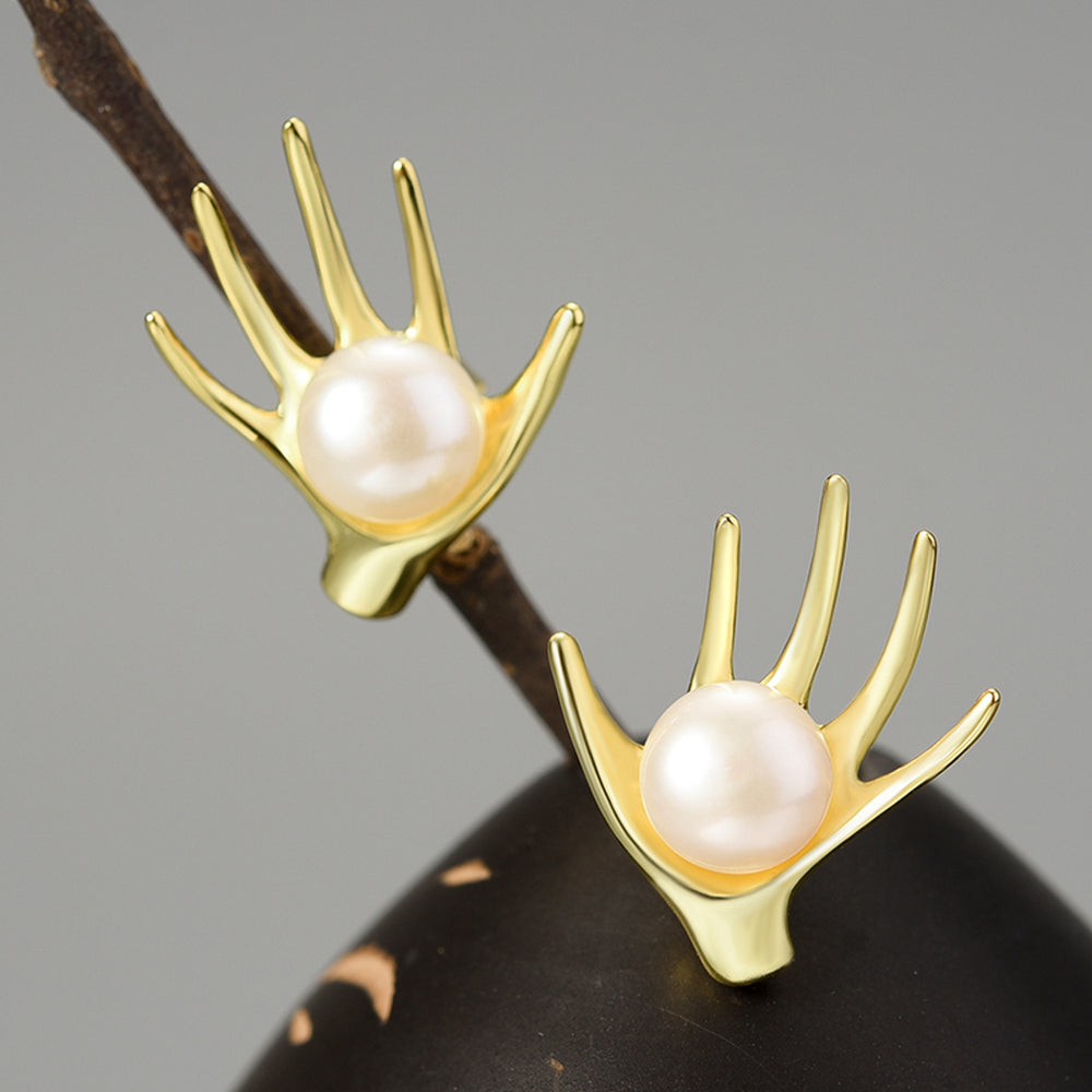 
                  
                    Earrings-With-Hand-And-Freshwater-Pearl-By-Yonandole_1
                  
                