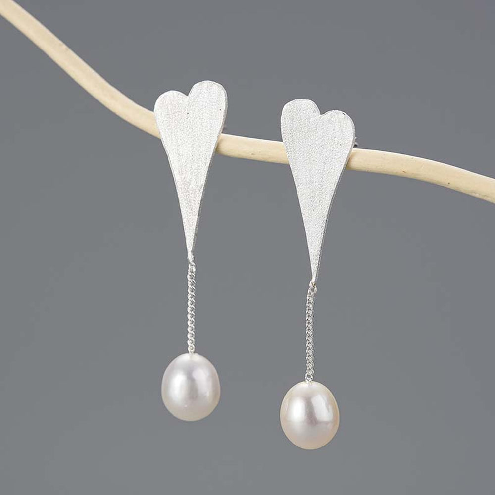 
                  
                    Earrings-With-Heart-And-Pearl-By-Yonandole_7
                  
                