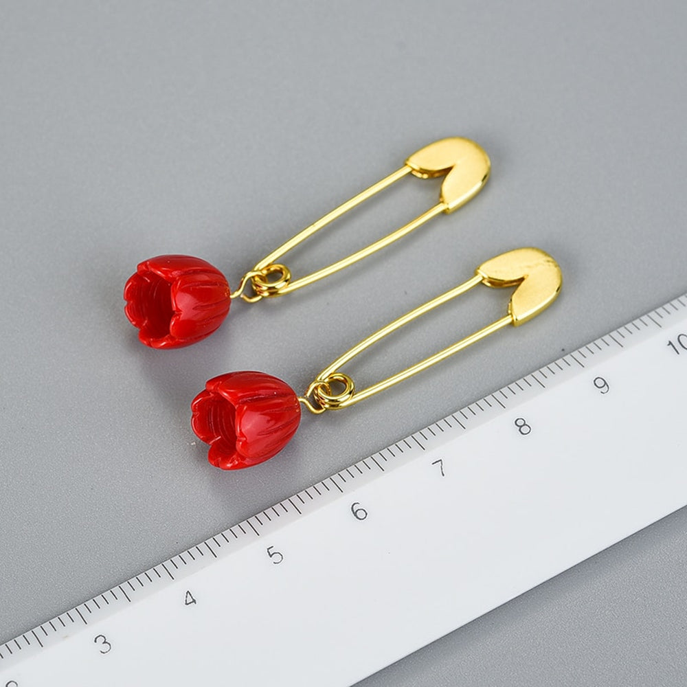 
                  
                    Earrings-With-Safety-Pin-And-Red-Blossom-By-Yonandole_5a
                  
                