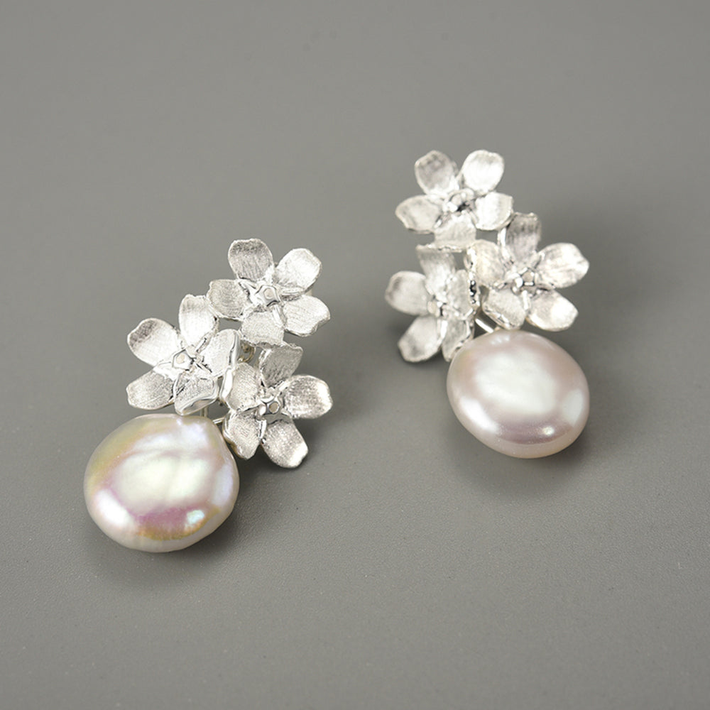 
                  
                    Forget-Me-Not-Earrings-With-Baroque-Pearl-By-Yonandole_1
                  
                