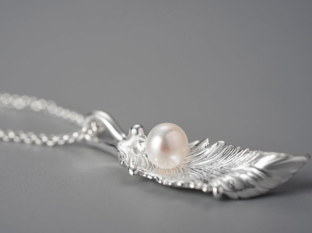 
                  
                    Leaf-Pendant-With-Freshwater-Pearl-By-Yonandole_9
                  
                