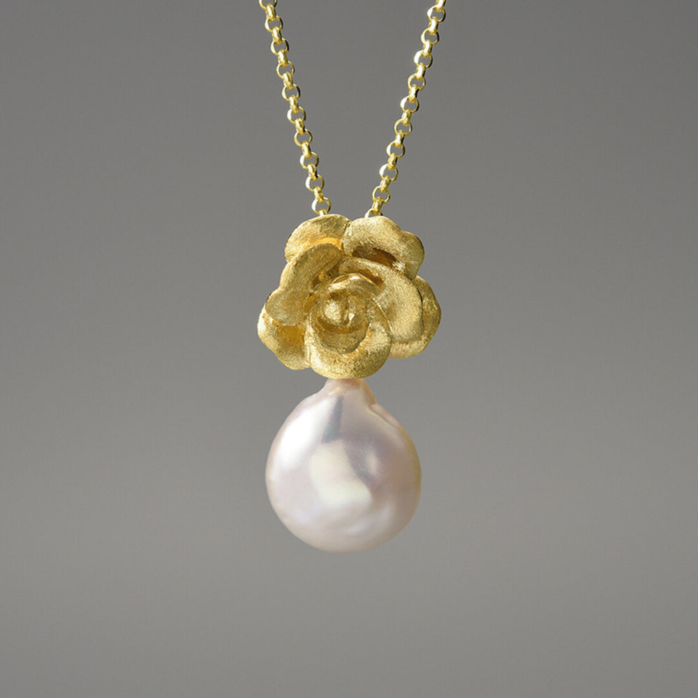 
                  
                    Necklace-And-Camellia-Pendant-With-Baroque-Pearl_By-Yonandole_6
                  
                