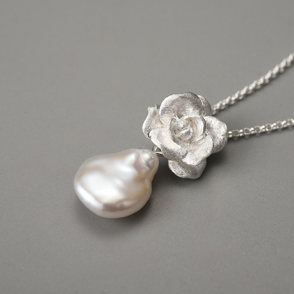 
                  
                    Necklace-And-Camellia-Pendant-With-Baroque-Pearl_By-Yonandole_9
                  
                