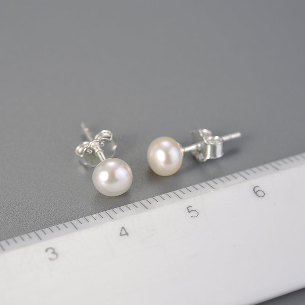 
                  
                    Stud-Earrings-With-A-Small-Freshwater-Pearl-By-Yonandole_2
                  
                