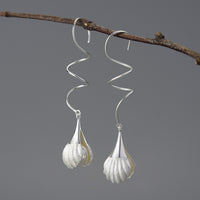 Wire-Earrings-With-Mother-Of-Pearl-Bead-In-A-Shell-Setting-By-Yonandole_1
