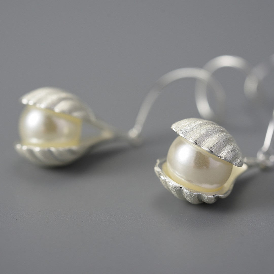 Wire-Earrings-With-Mother-Of-Pearl-Bead-In-A-Shell-Setting-By-Yonandole_2